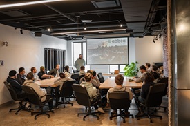 The team gathered around a table during a meeting