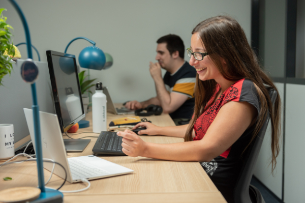 A woman works at her desk